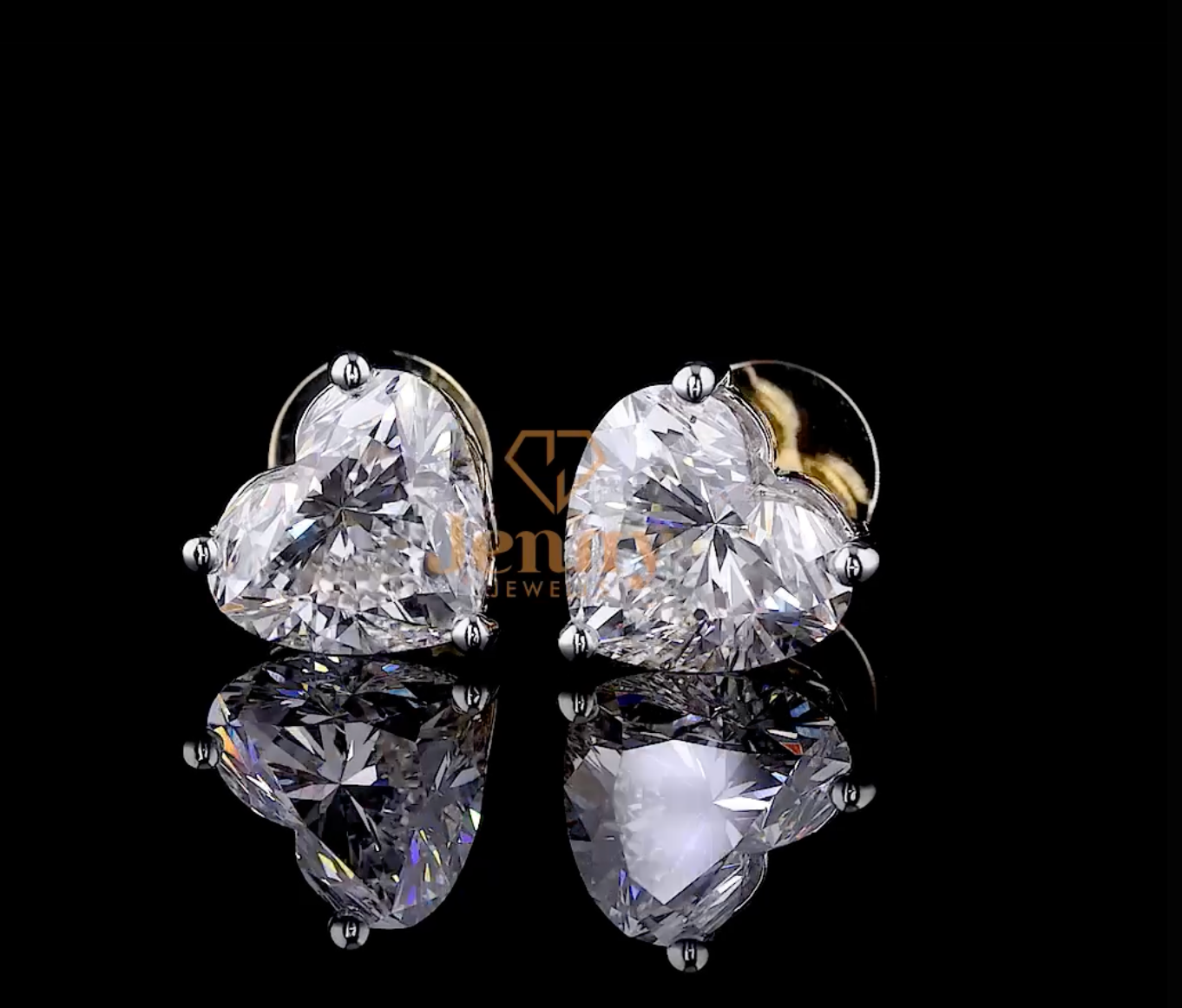Heart-cut diamond earrings set in 14K or 18K white gold. A romantic and elegant jewelry piece, perfect for special occasions and everyday wear.