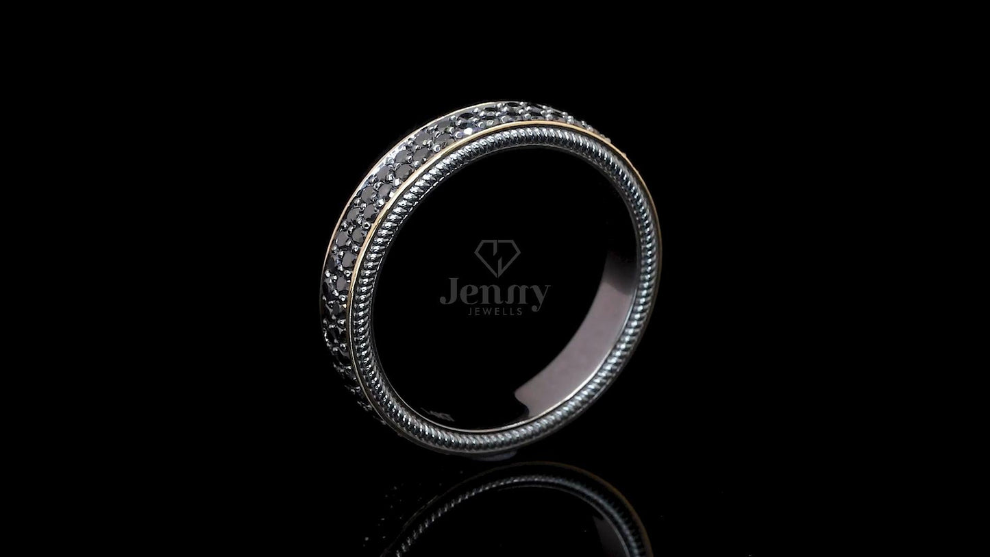 Side profile of modern black diamond band ring with pavé set diamonds