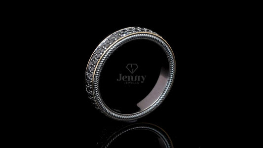 Side profile of modern black diamond band ring with pavé set diamonds