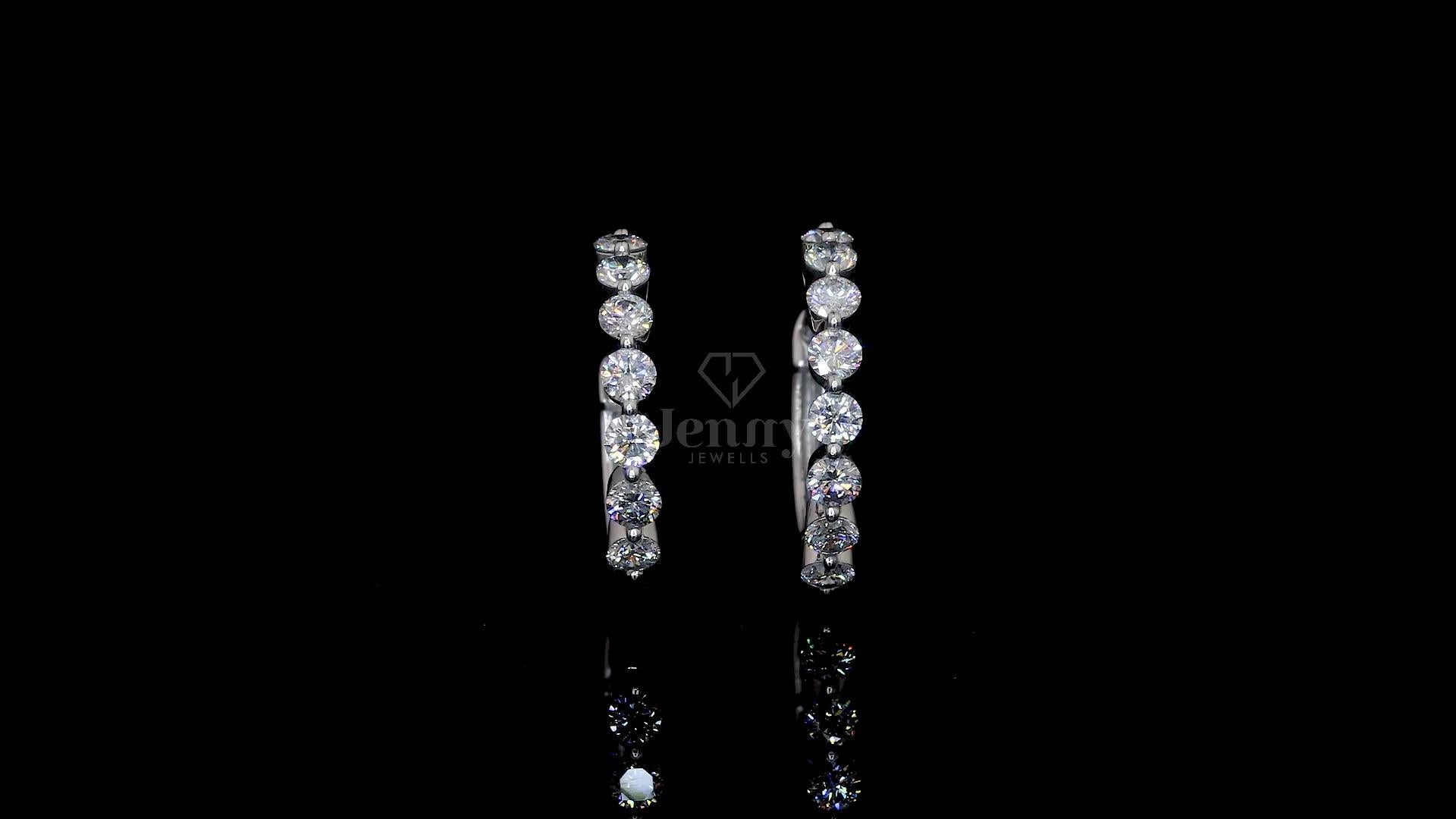 Elegant lab-grown diamond hoop earrings in white gold featuring 16 round diamonds totaling 1.60 carats.